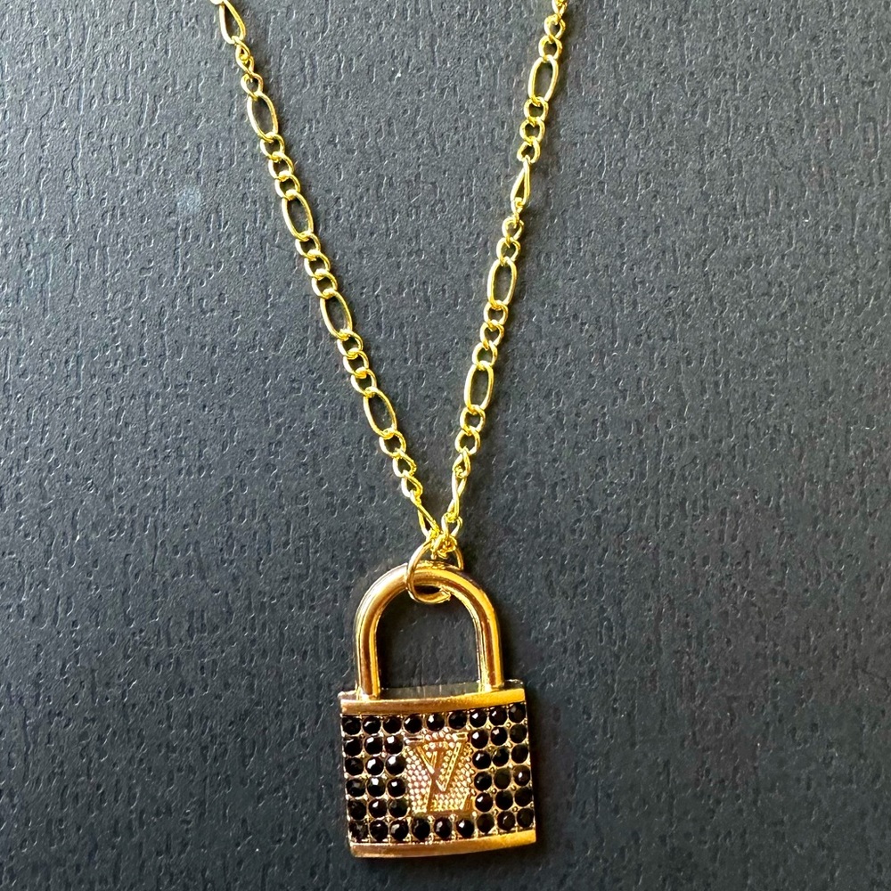 Gold LV necklace with black diamonds